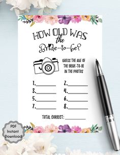 a wedding game with flowers on it and a pen next to the question card for how old was the bride - to - be?