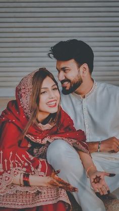 a man and woman sitting next to each other