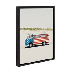 a van with an american flag painted on it's side is parked in the sand