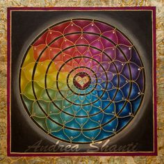 a painting with many colors in the center and a heart on it's side