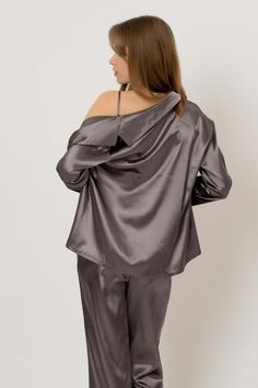 Be cocooned in a soft, sumptuous feel fabric. The perfect set for rest and relaxation, the luxe three-piece pajama set features a bra top with V-neckline, matching pants, and long sleeve pajama shirt.

 The matching bra top features a V-neckline, cropped, triangle silhouette, and adjustable straps.
The matching pants feature a high-waisted, relaxed silhouette and ribboned waist.
The pajama shirt comes in satin and features an oversized, longline silhouette, button-down closure, and V-neckline. Bandage Midi Dress, Pink Fits, Half Skirt, Rest And Relaxation, Feather Dress, Matching Pants, Type Of Pants, Slim Fit Pants, Pajama Shirt