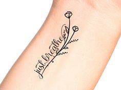 a woman's arm with a tattoo on it that says, love is all around her