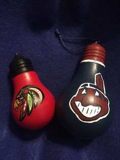 two light bulbs with the chicago black hawks on them are sitting next to each other