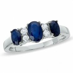 three stone sapphire and diamond ring in white gold