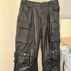 Never Worn! Black Faux Leather Cargo Pants From Rehab Lab. Size L Casual Black Faux Leather Cargo Pants, Black Faux Leather Cargo Pants With Pockets, Black Faux Leather Bottoms With Side Pockets, Black Faux Leather Cargo Pants, Black Leather Pants With Multiple Pockets For Fall, Edgy Faux Leather Bottoms With Pockets, Faux Leather Wide Leg Bottoms For Streetwear, Wide Leg Faux Leather Bottoms For Streetwear, Black Faux Leather Pants With Cargo Pockets