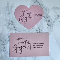 two pink thank you cards with black writing on them, one has a heart and the other says thank george