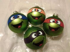 four green ornaments with angry birds on them