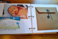 a baby's birth album is open to show the contents