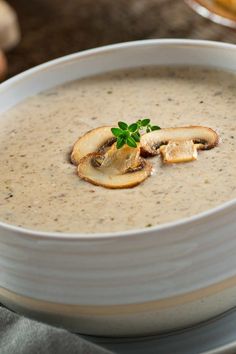 a white bowl filled with soup on top of a table