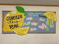 a school bulletin board with lemons and saying squeeze this year on the front wall