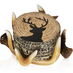 a wooden box with an animal's head carved into the top and two antlers sticking out of it