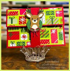 an origami christmas card with a deer on it