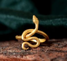 18k Gold snake ring,Snake Wrap Ring,adjustable snake ring,gold wrap ring,Gothic,Hippie,spiral ring,brass ring, Graduation Gift **hello** every one.. This is a gold snake ring that can be adjustable to any size - it is a one size fits all ring . The ring is made of high quality brass and is gold plated - very popular and a wonderful design * Love the ring but have a few design ideas of your own? Please contact me and I would be pleased to create something just for you! * All my designs are custom handmade by me with love and care using traditional metalsmithing techniques in my studio Size: All size are available. from US 1 to US 16 All Arthritis Rings Available Quantity: Optional Metal:- Brass , Silver , Brass Gold Plated , Brass Rose Gold & Also Silver We Provide the Excellent Quality Jew Snake Ring Gold, Gothic Hippie, Gold Wrap Ring, Ring Guard, Spiral Ring, Gold Wrap, Wrap Ring, Snake Ring, Gold Snake