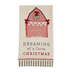 a white towel with a red barn on it and the words dreaming of a farm christmas