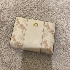 Nwt Never Used 5 In X 3.75 In Cute Coach Wallet, Elegant Compact Coach Trifold Wallet, Elegant Compact Coach Bag, Cream Bifold Wallet With Interior Card Slots, Elegant Gold Coach Coin Purse, Elegant Coach Beige Coin Purse, Cream Bifold Wallet For Daily Use, Elegant Rectangular Coach Coin Purse, Elegant Compact Coach Wallet