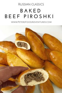 a person is holding up some food on a plate with the words russian classic baked beef proshki