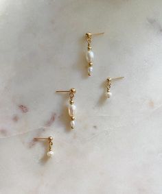 Super dainty, minimal freshwater pearl studs. Pictured with the Rhiannon Freshwater Pearl Stud Earrings and the Midi Pearl Studs. Available as a set: Signature Ear Stack Set VI. Diy Earrings Pearl, Ear Stack, Jewelry Lookbook, Pearl Stud Earrings, Dream Jewelry, Pearl Studs, Ear Jewelry, Jewelry Lover, Diy Earrings