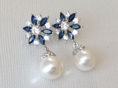 White Pearl Blue Clear Crystal Floral Silver Wedding Bridal Earrings. EARRINGS are about 1.18 inch (3cm) long from top of ear stud to bottom. BRIDAL EARRINGS SECTION: https://www.etsy.com/shop/LanaChayka?ref=seller-platform-mcnav§ion_id=11638940 BRIDAL JEWELRY SETS SECTION: https://www.etsy.com/shop/LanaChayka?ref=seller-platform-mcnav§ion_id=25839214 BRIDAL NECKLACES SECTION: https://www.etsy.com/shop/LanaChayka?ref=seller-platform-mcnav§ion_id=11638944 Elegant and timeless, these beautiful ear Blue Teardrop Pearl Earrings For Wedding, Blue Pearl Drop Wedding Jewelry, Blue Pearl Drop Jewelry For Wedding, Blue Pearl Drop Bridal Earrings For Wedding, Blue Round Pearl Earrings For Wedding, Blue Wedding Earrings, Bridal Pearl Jewelry, Wedding Earrings Pearl, Blue Earrings Wedding