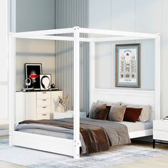 a white bed sitting in a bedroom next to a dresser