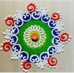 this is an image of a colorful ornament made out of felt and yarn