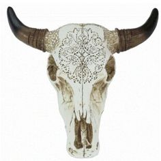 an animal skull with long horns and intricate designs on it's face, against a white background