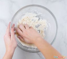 someone is mixing ingredients in a glass bowl