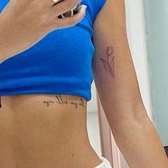 a woman with a cell phone in her hand and writing on her stomach that says, if you kill rage