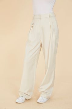 Straddle the line between polished and relaxed with our Pleated Wide Leg Pants. The front pleats lend a formal touch, while the wide leg and loose fit allow for a more relaxed, comfortable style. Available in an elegant cream color, these women’s pleated pants seamlessly transition from refined to casual, offering versatility for various occasions. Elevate your wardrobe with this sophisticated yet laid-back staple. Pleated Wide leg Loose fit Match with Double Pocket Crop Jacket style 75405 Dry c Chic Pleated Beige Bottoms, Chic Beige Wide Leg Dress Pants, Chic Beige Wide-leg Dress Pants, Beige Pleated Wide-leg Pants, Elegant Beige Wide-leg Dress Pants, Beige Pleated Straight Pants, Elegant Pleated Pants With Relaxed Fit, Beige High-waisted Pleated Pants, Chic Cream Wide Leg Pants For Formal Occasions