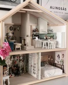 a doll house with furniture and accessories inside