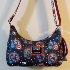 Loungefly Marvel Classic Super Heroes Handbag. Inside Is 1 Zippered Pocket And I Slip Pocket Adjustable Woven Shoulder Strap Also Comes With A Coin Purse. Approximately 9.5" L X 6.25 H Faux Leather A Collector Piece. Zipper Closure Loungefly Crossbody Bag, Loungefly Lisa Frank, Spiderman Loungefly, Marvel Loungefly, Minnie Mouse Bag, Loungefly Bag Pokemon, Minnie Mouse Purse, Christmas Purse, Loungefly Purse