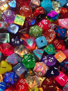 many different colored dices with numbers on the sides and numbers on the outside side