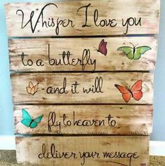 a wooden sign with butterflies on it that says, whisper i love you to a butterfly and