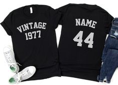 two shirts that say vintage and the number 30 are next to each other with sneakers