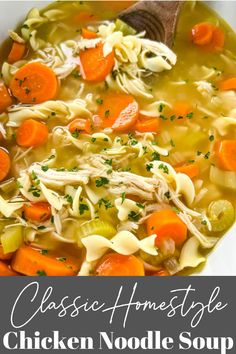 chicken noodle soup in a white bowl with a wooden spoon