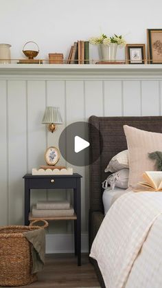 a bed room with a neatly made bed and a book shelf