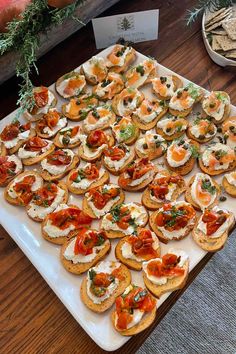 an assortment of appetizers are displayed on a platter