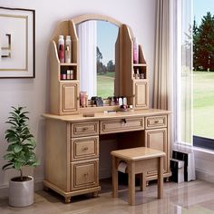 a dressing table with mirror and stool in front of a window