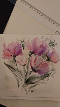 watercolor painting of pink flowers on white paper