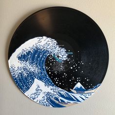 a black and white plate with an image of the great wave on it's side