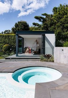 an outdoor swimming pool in the middle of a yard with steps leading up to it