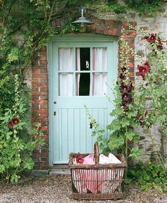 a green door with a basket in front of it