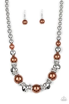 A collection of over-sized brown pearls, silver rings, and asymmetrical silver beads are threaded along an invisible wire below the collar. White rhinestone encrusted rings are sprinkled between the refined beading for a statement-making finish. Features an adjustable clasp closure. Brown Pearls, Brown Bracelet, Bling Necklace, Brown Necklace, Mom Wedding, Bold Earrings, Silver Bead Necklace, Elegant Bracelet, Paparazzi Accessories