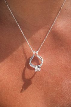 Safeguard your cherished rings with our Horseshoe 🧲 Ring Holder Necklace, combining functionality with an elegant design. This stylish necklace features a beautiful scallop shell motif, providing a secure and sophisticated way to keep your rings close to your heart. Premium Materials: Expertly crafted from high-quality 925 sterling silver over 14k gold plated or rhodium , ensuring durability and a radiant shine.  * Elegant Design: Features a scallop shell-inspired pendant with a secure ring holder, allowing you to attach and remove rings effortlessly.  * Versatile Style: Perfect for everyday wear or special occasions, adding a touch of elegance to any outfit.  * Adjustable Chain: Comes with an adjustable chain to ensure a comfortable and perfect fit for any neckline.  * Perfect Gift: Idea Silver Jewelry With Si Clarity For Anniversary, Anniversary Jewelry In Silver With Si Clarity, Vs Clarity Pendant Jewelry For Anniversary, Drop Engagement Ring, Ring Holder Pendant, Engagement Ring Necklace, Ring Holder Necklace, Coquille Saint Jacques, Horseshoe Ring