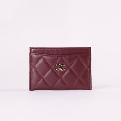 * Burgundy Quilted Lambskin Leather* Silver-Tone Hardware * Interlocking CC Accent at Front Face* Four Card Slots* Tonal Stitching * Dimensions: L 4.3" x H 3" Luxury Classic Red Card Holder, Ysl Card Holder Hearts, Burgundy Car, Chanel Card Holder, Dream Wishlist, Red Chanel, Classic Card, Front Face, Car Holder