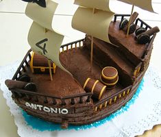 a cake shaped like a pirate ship with sails