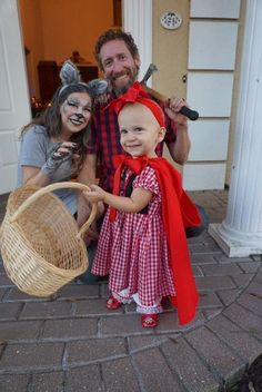 two adults and a child dressed up in costumes