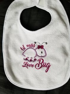 Embroidered baby bib for your child or for that someone you know. Or even for a child's special doll. Give that new baby a gift that they will use over and over, while showing off their personality. Thread Color: The colors on your computer/laptop/phone/tablet may differ slightly from what colors used on the finished product. All items are handmade to order. Velcro enclosure. 75% Cotton, 25% Polyester, for easy cleaning. Washing Instructions: Machine wash cold, line, air, or cold dry. Processing Time: All orders are 5-7 days. Items are shipped through USPS First Class Mail with a tracking number, within the United States. If you have any questions, please feel free to message me. Cute Cotton Bib As Gift, Playful Cotton Bib As A Gift, Cute White Crafts For Gifts, Cute White Bib For Playtime, Pink Cotton Bib As A Gift, Pink Cotton Bib As Gift, Cute Machine Washable Bib As Gift, Personalized Cotton Bib As Gift, Playful Machine Washable Bib As Gift