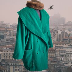 A beautiful and unique vivid green wool winter coat. Bohemian loose-fit women's coat with Double-breasted, long sleeves, chunky shoulder pads, and prominent collar. There is no size tag but I Would guess it's an  XL (The mannequin Is size Medium so the coat sits as a nice oversized one on it). but please follow the measurements below for a perfect fit. length: 93 cm/ 36.61" bust (from armpit to armpit): 70 cm/ 27.55" shoulder: 23 cm/ 9" shoulder line: 60 cm/ 23.62" sleeve length: 55 cm/ 21.65" p Oversized Wool Outerwear With Shawl Collar, Wool Outerwear With Shawl Collar For Winter, Oversized Winter Wool Coat With Pockets, Green Wool Coat For Winter, Oversized Wool Coat With Pockets For Winter, Winter Oversized Pea Coat With Buttons, Oversized Winter Pea Coat With Buttons, Oversized Winter Pea Coat, Oversized Shawl Collar Outerwear For Winter