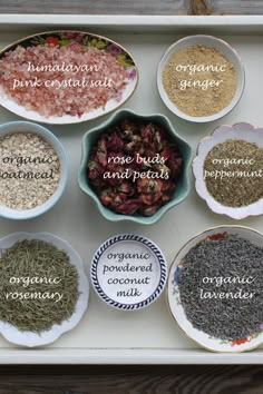 an assortment of different types of spices in bowls on a tray with words describing them