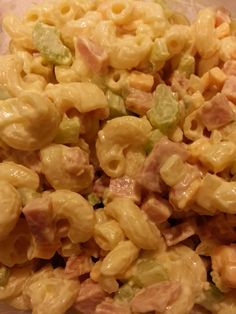 macaroni salad with ham and cheese in a plastic container